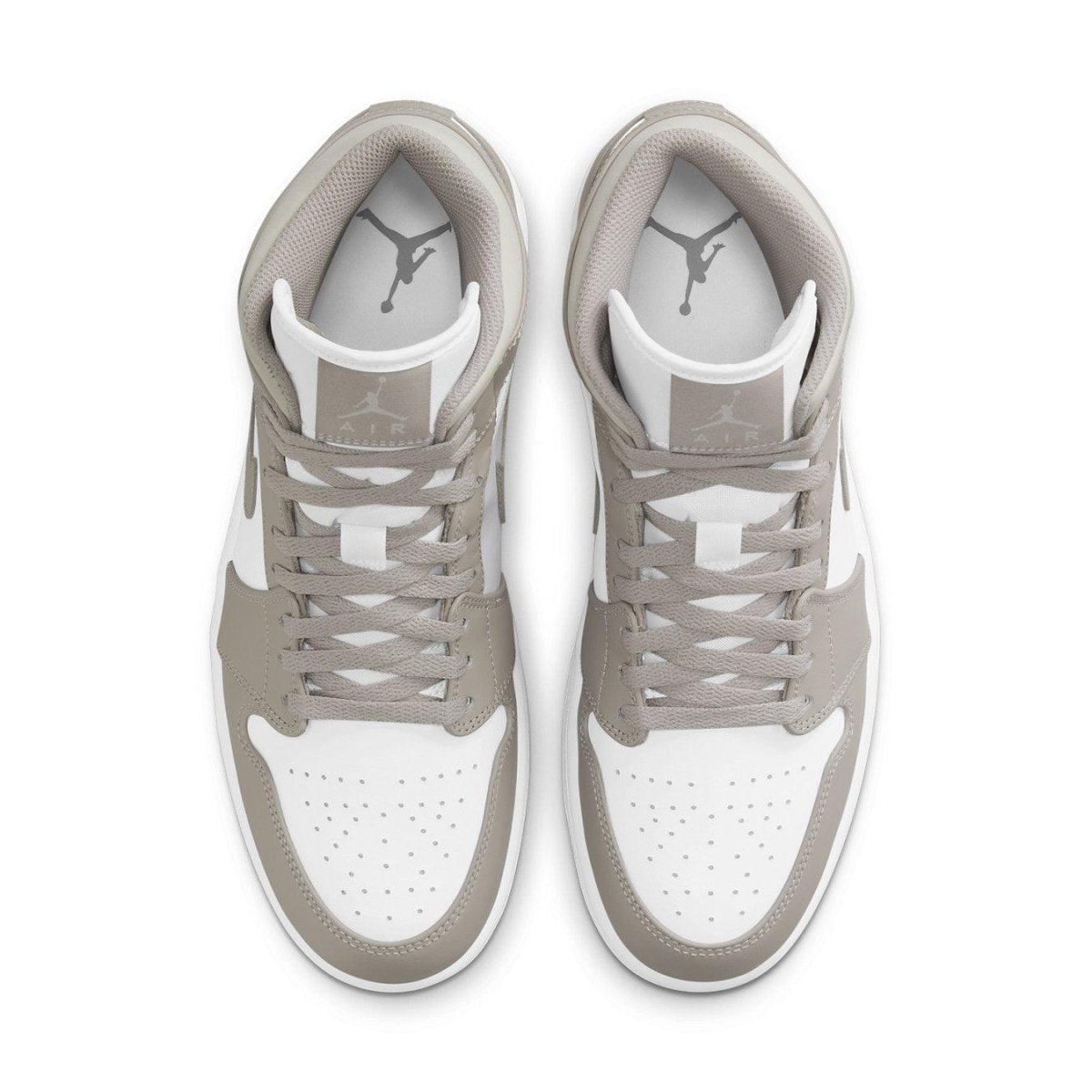 Jordan 1 Mid Linen sneakers featuring white leather upper and College Grey accents, top view.