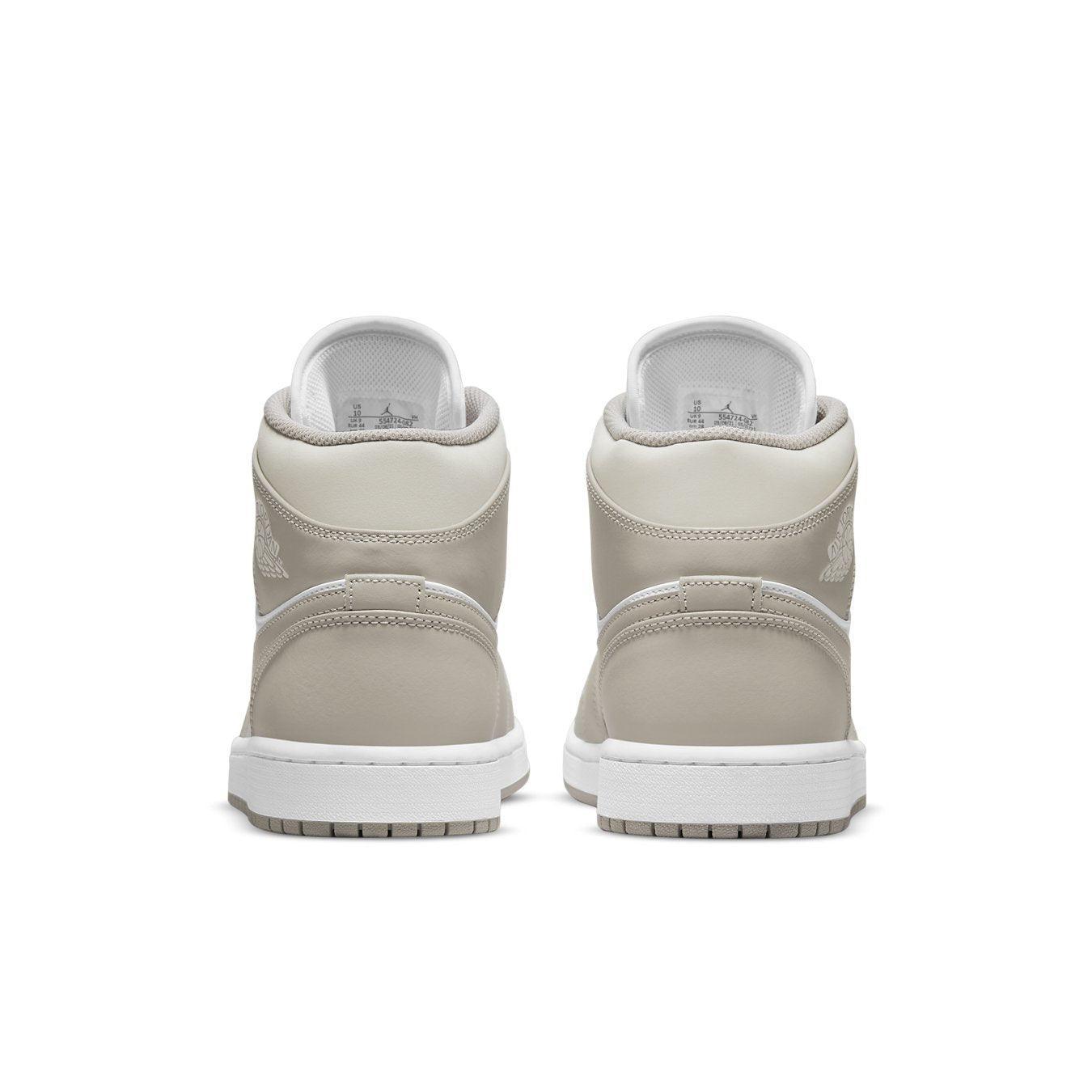 Jordan 1 Mid Linen sneakers in College Grey with white leather and linen accents, showcasing the rear view design.