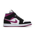 Nike Air Jordan 1 Mid Magenta women's sneaker with black suede, white leather, and contrasting magenta accents.