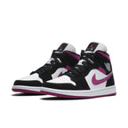 Air Jordan 1 Mid Magenta (W) featuring black suede, white leather, and vibrant magenta accents.