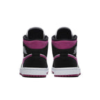 Back view of Air Jordan 1 Mid Magenta (W) showcasing black suede and pink accents, perfect for women.