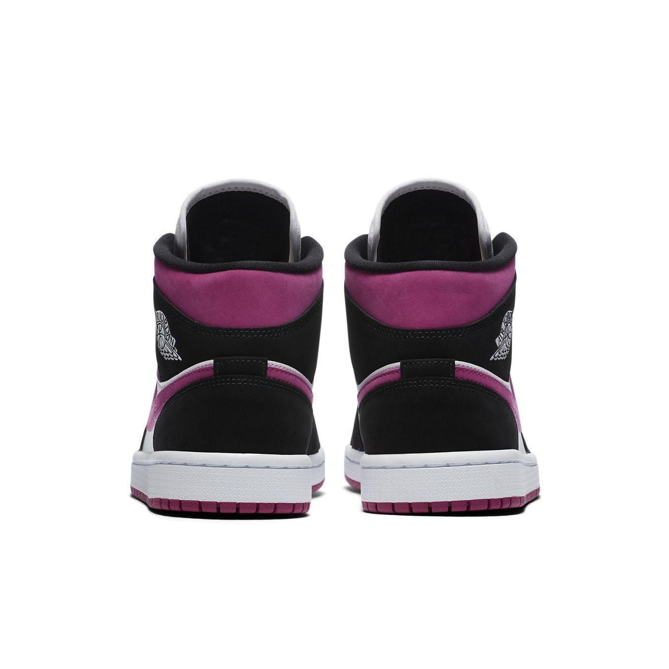 Back view of Air Jordan 1 Mid Magenta (W) showcasing black suede and pink accents, perfect for women.