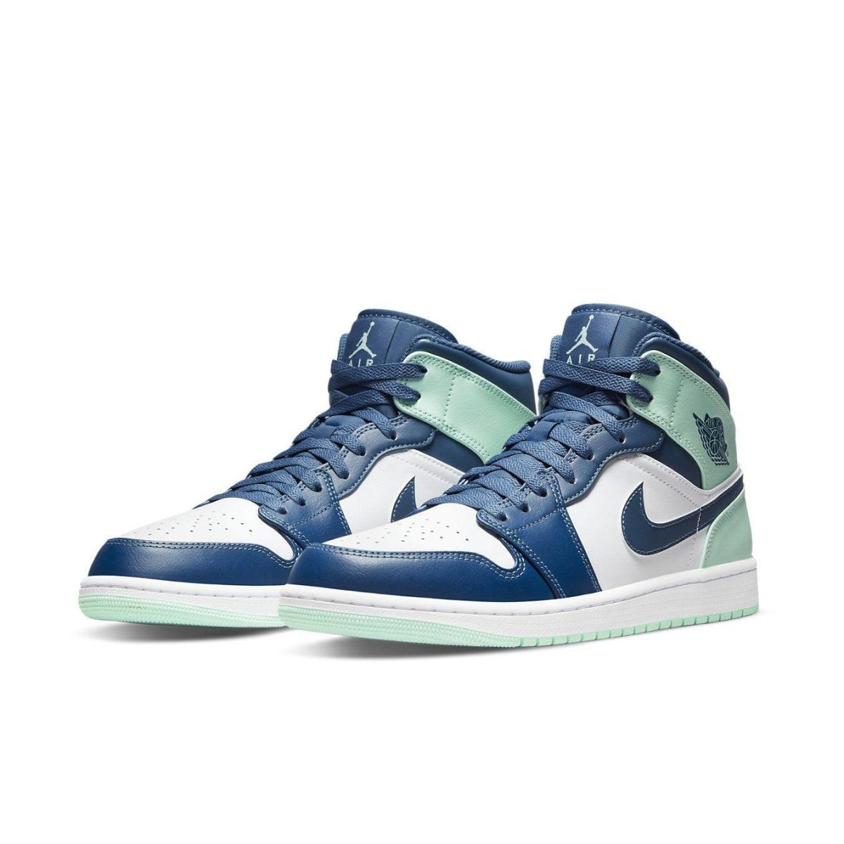 Air Jordan 1 Mid Mystic Navy Mint Foam sneakers in white leather with navy overlays and mint accents.