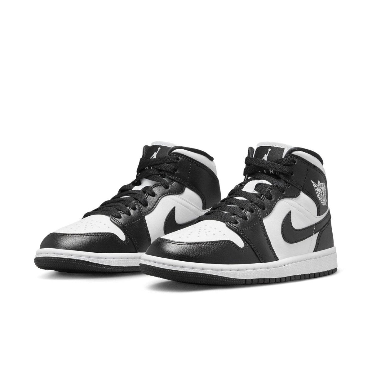 Nike Air Jordan 1 Mid Panda Women's shoes in black and white, featuring classic design and iconic Swoosh logo.