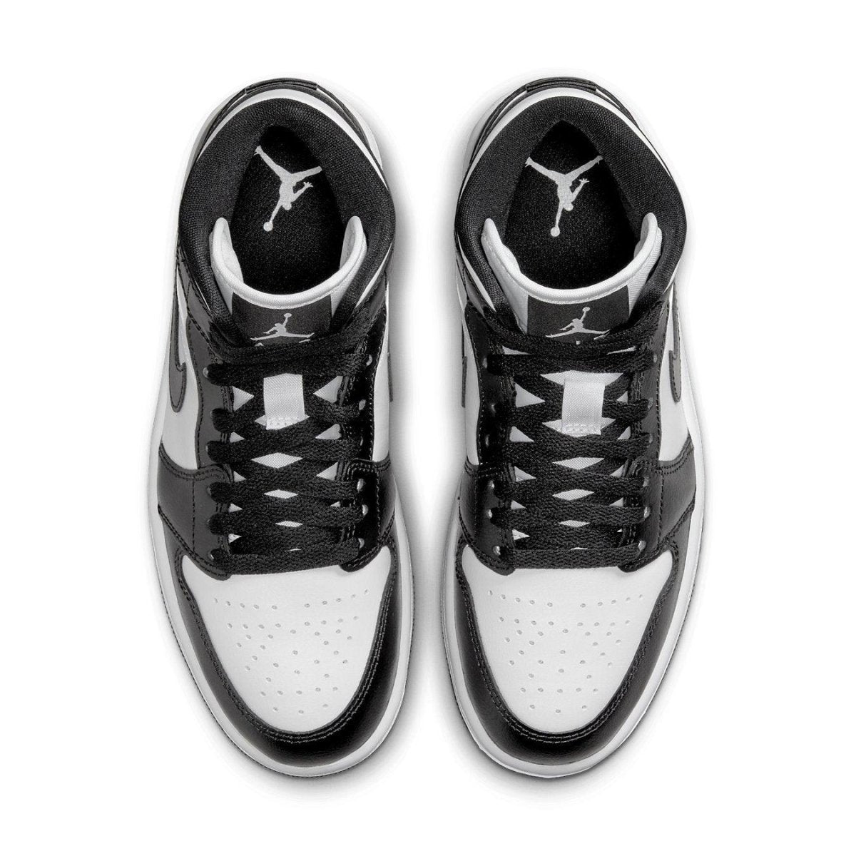 Top view of women's Jordan 1 Mid Panda sneakers featuring a black and white colorway and iconic Jordan logo.