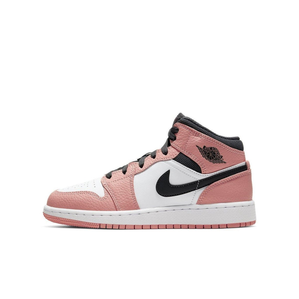Air Jordan 1 Mid GS 'Pink Quartz' sneaker, featuring pink and white leather with black accents and vintage logos.