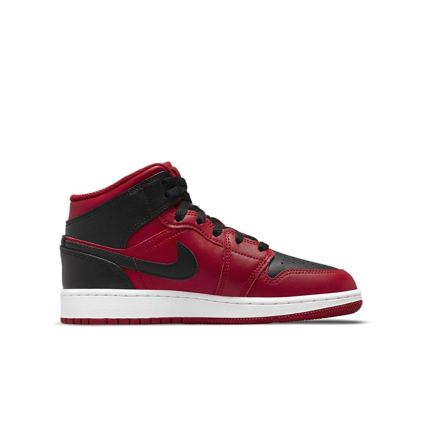 Jordan 1 Mid Reverse Bred (2021) GS sneaker in red and black side view on white background.