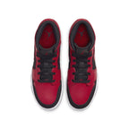 Top view of Air Jordan 1 Mid Reverse Bred GS sneakers featuring red and black leather. Classic design with iconic logo.