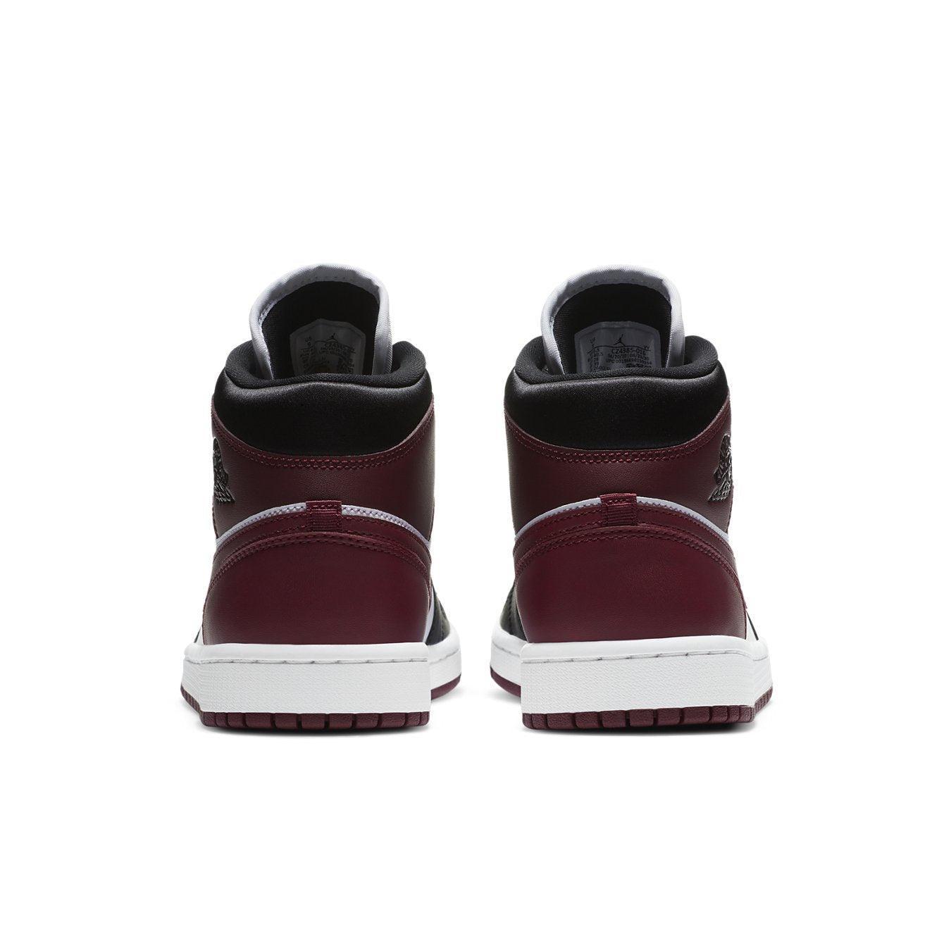 Back view of the Jordan 1 Mid SE Black Dark Beetroot (W) showcasing stylish burgundy and black leather detailing.