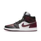 Jordan 1 Mid SE Black Dark Beetroot women's sneakers featuring gold accents and classic silhouette.