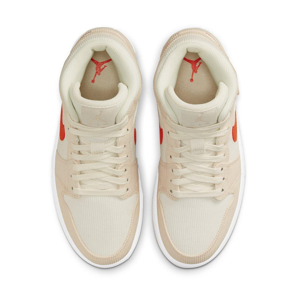 Top view of Air Jordan 1 Mid SE Corduroy Sail featuring corduroy upper in cream and peach with bright orange Swoosh.