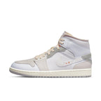 Jordan 1 Mid SE Craft Inside Out in white and grey with layered panels and premium materials.
