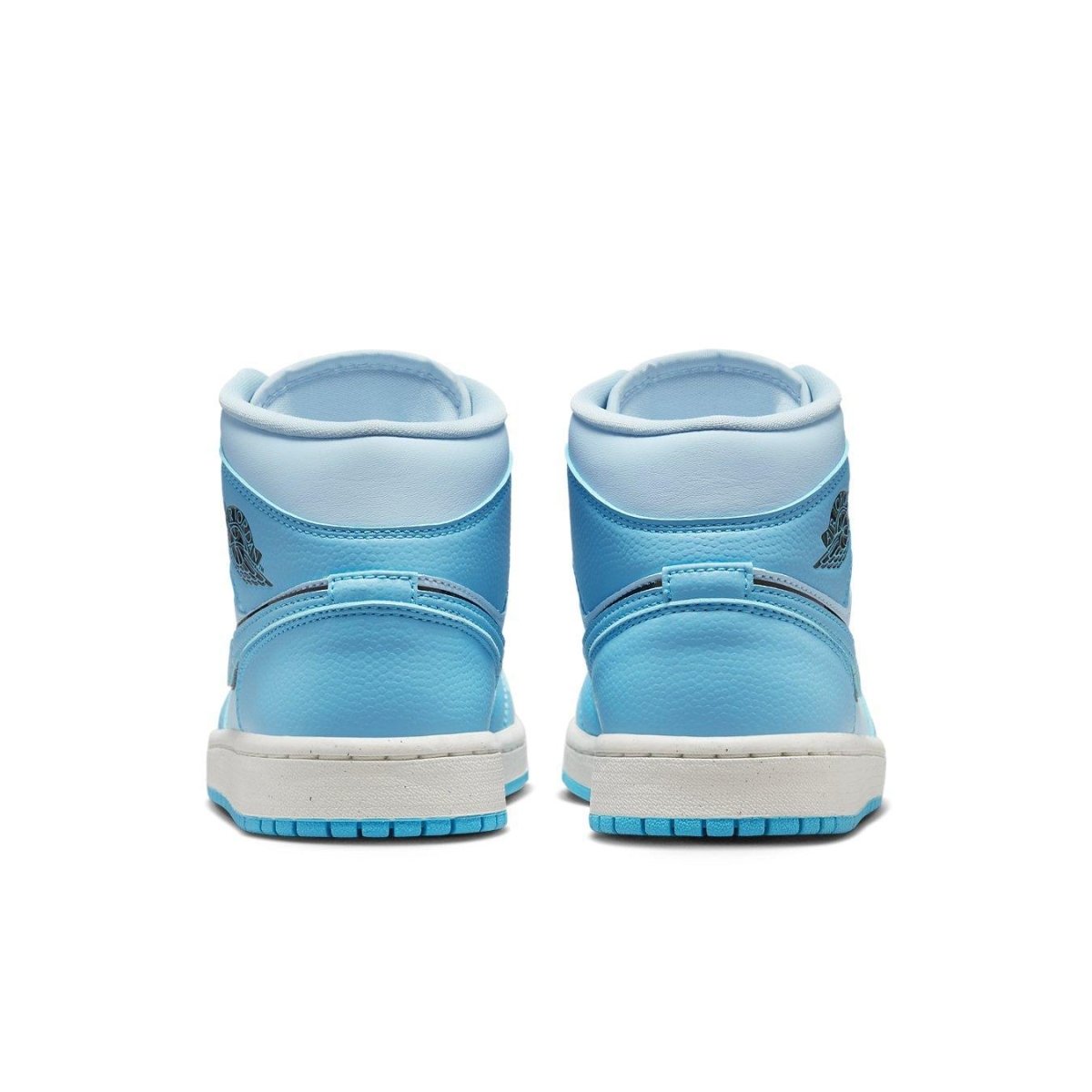 Back view of Women's Air Jordan 1 Mid SE Ice Blue sneakers showcasing elegant blue tones and classic logo design.