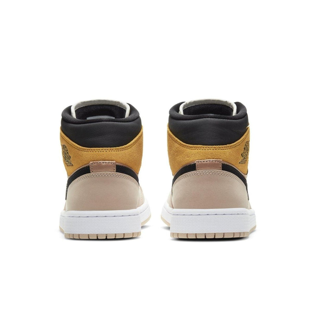 Back view of the Jordan 1 Mid SE Particle Beige women's sneakers with stylish color blocking.