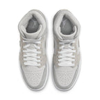 Jordan 1 Mid SE Particle Grey women's sneakers featuring synthetic leather and suede in varying shades of grey.