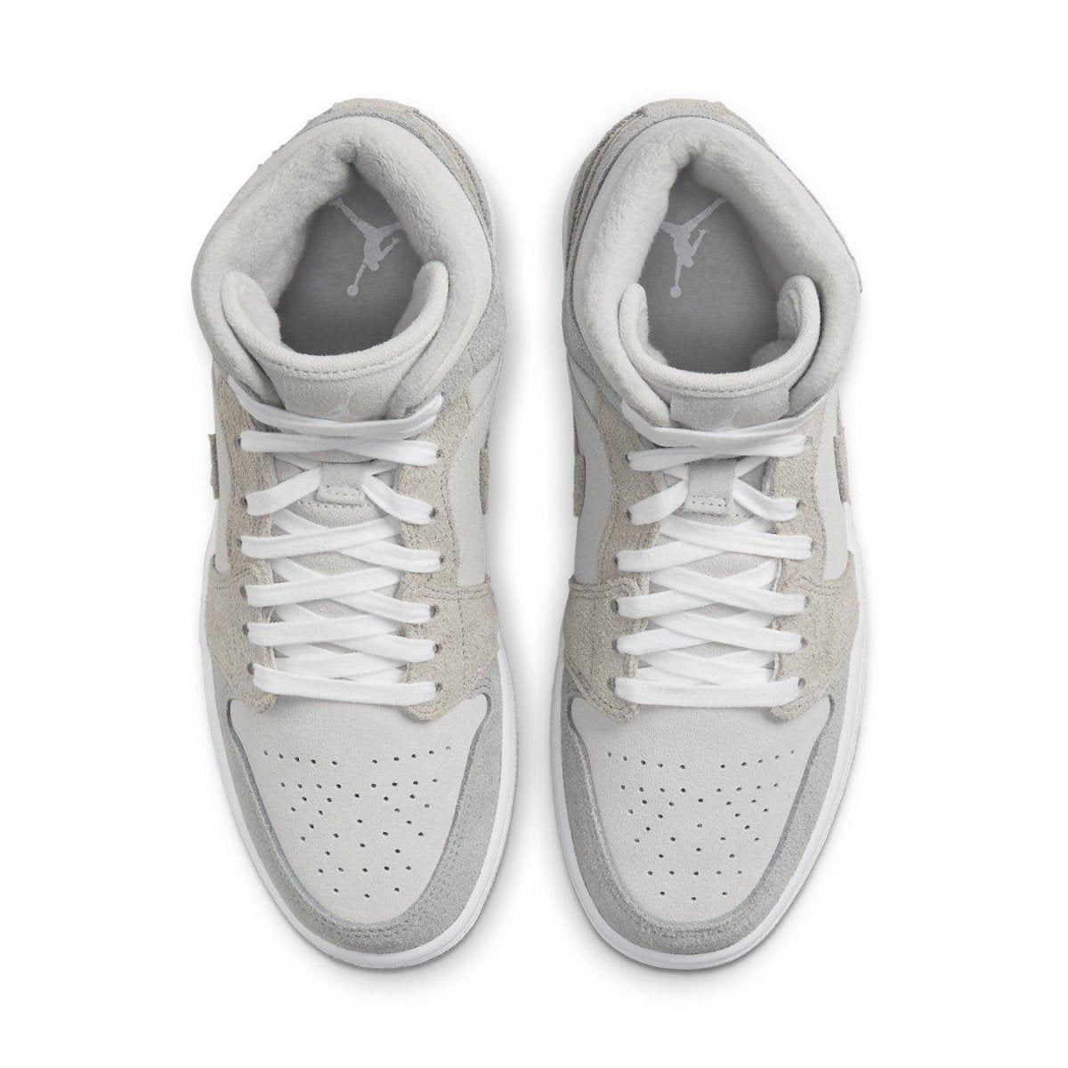 Jordan 1 Mid SE Particle Grey women's sneakers featuring synthetic leather and suede in varying shades of grey.