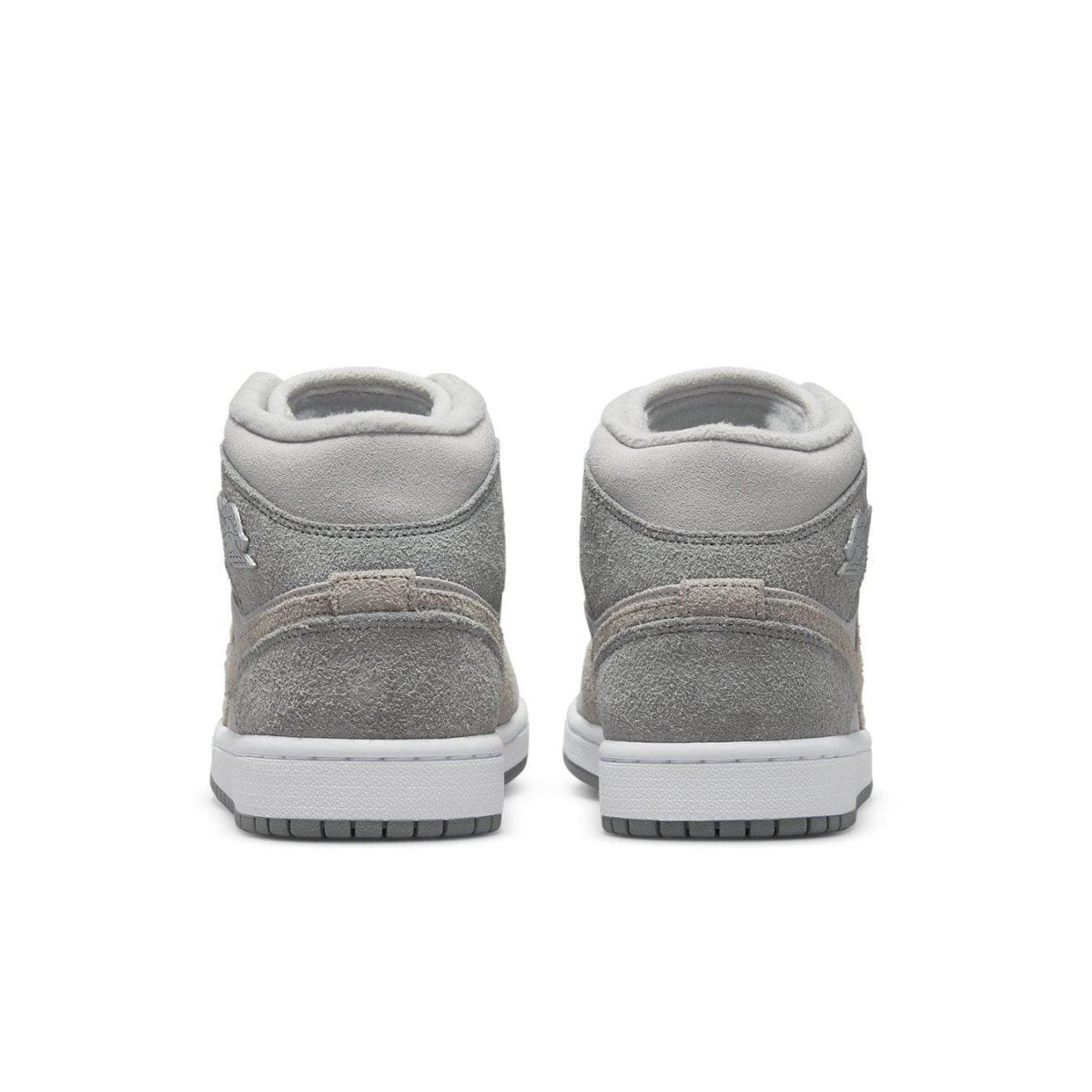 Rear view of Women's Jordan 1 Mid SE Particle Grey sneakers featuring textured grey suede and sleek design.