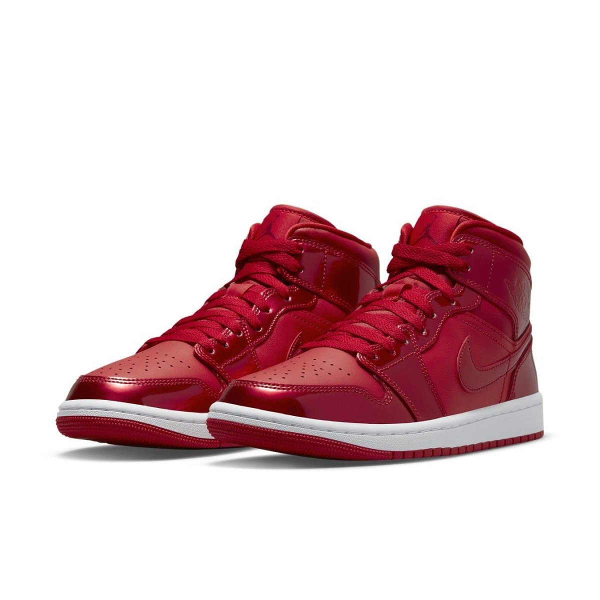Jordan 1 Mid SE Pomegranate women's sneakers in bright red leather with white sole, a perfect festive footwear choice.