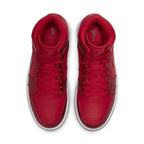 Jordan 1 Mid SE Pomegranate women's sneakers in vibrant cherry red with sleek leather upper and iconic Jordan details.