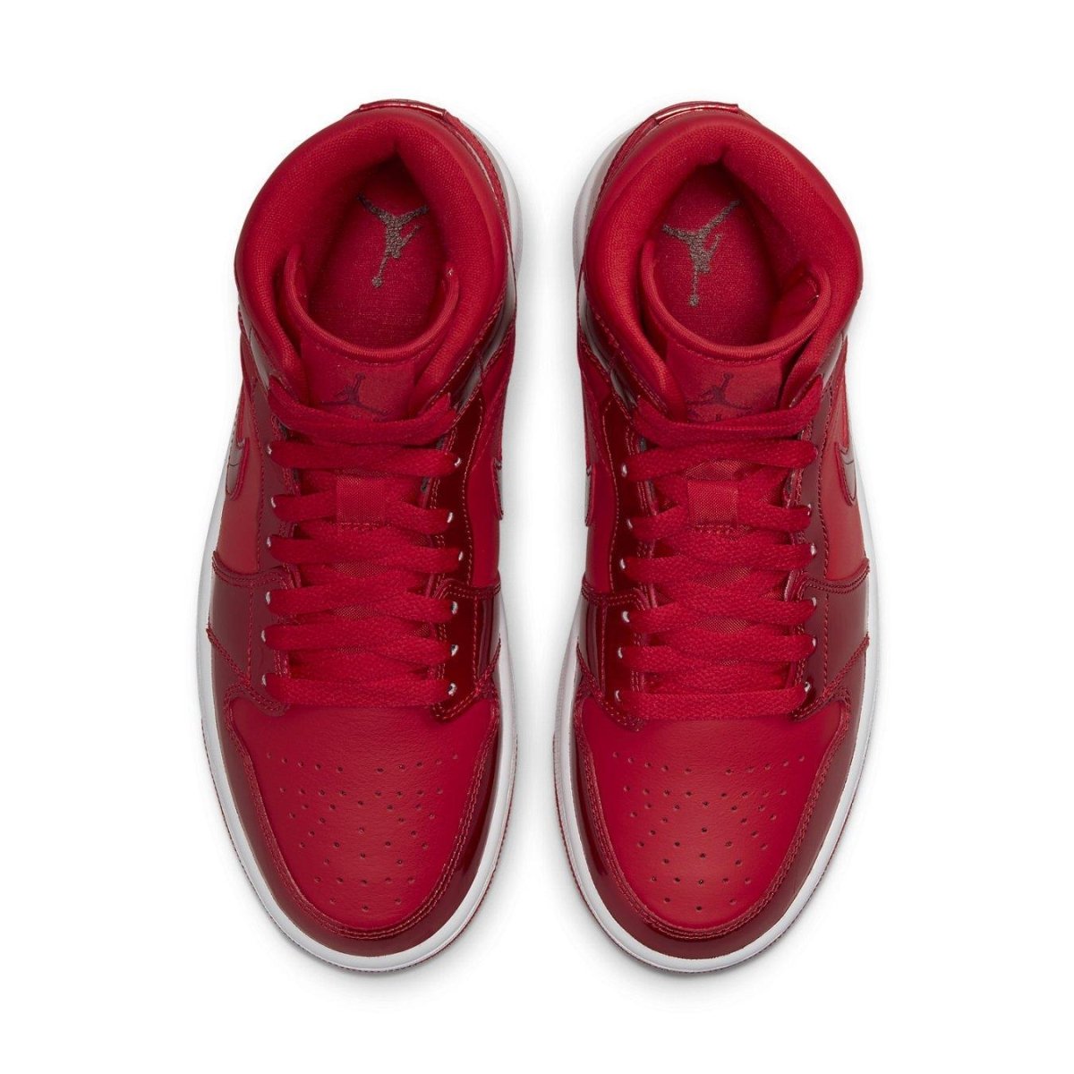 Jordan 1 Mid SE Pomegranate women's sneakers in vibrant cherry red with sleek leather upper and iconic Jordan details.
