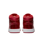 Jordan 1 Mid SE Pomegranate women's shoes featuring a vibrant glossy red finish, perfect for the holiday season.