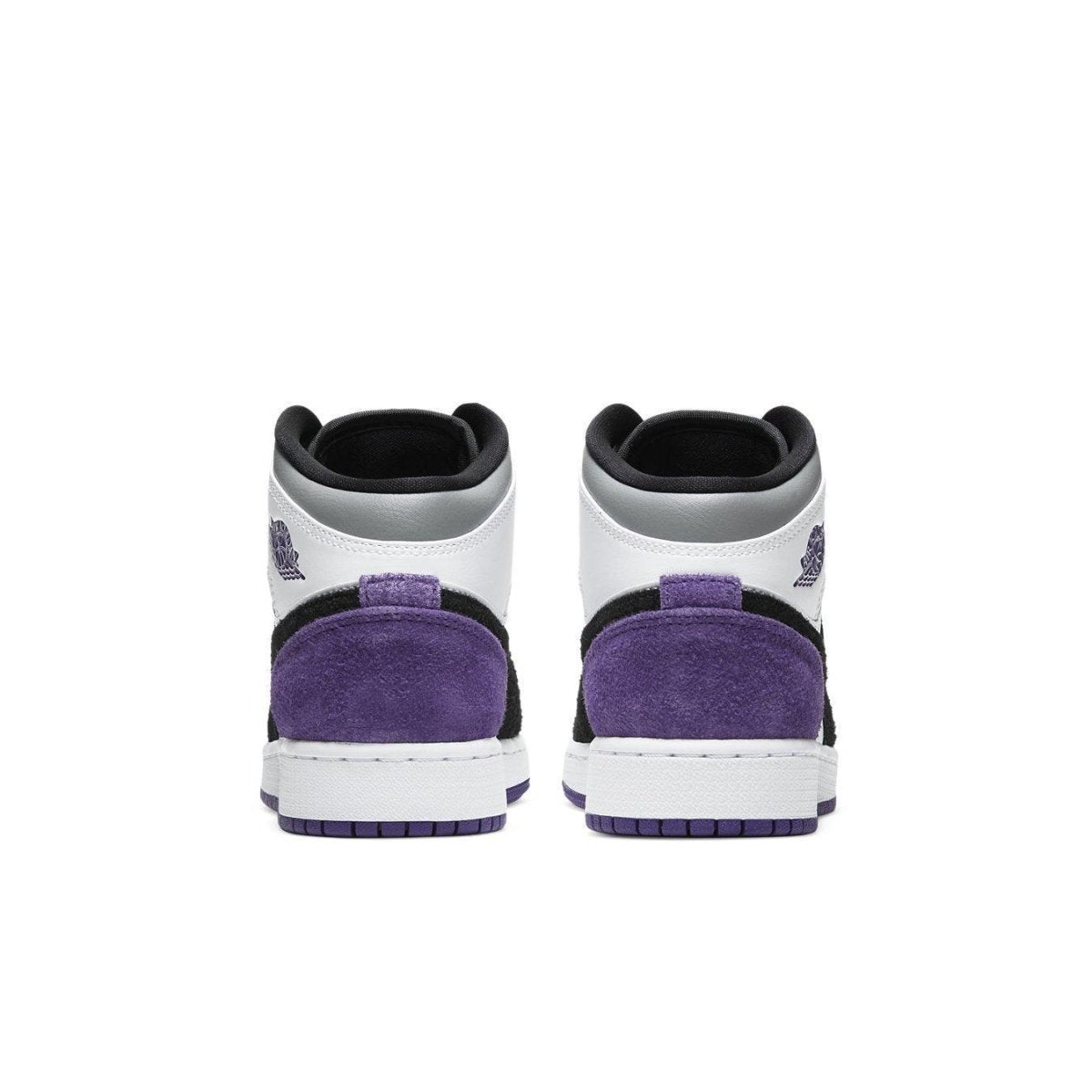 Back view of the Jordan 1 Mid SE Purple (GS) sneakers with suede details and classic color scheme.