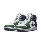 Jordan 1 Mid SE Seahawks (W) sneakers in white and green, featuring navy blue accents and Air Jordan branding.