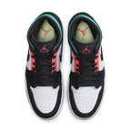 Top view of Jordan 1 Mid SE South Beach sneakers showcasing black suede, white leather, and pink-green accents.