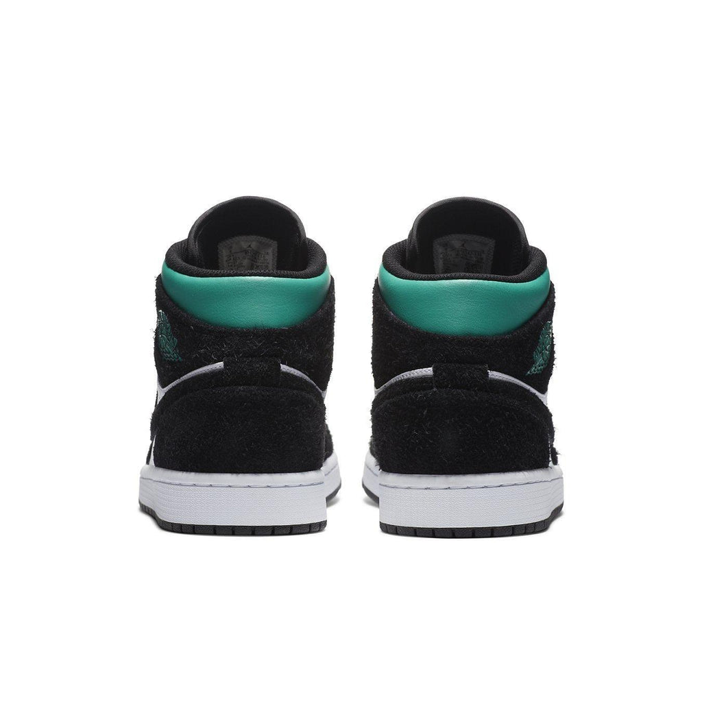 Rear view of Jordan 1 Mid SE South Beach sneakers showcasing black suede and aqua accents.