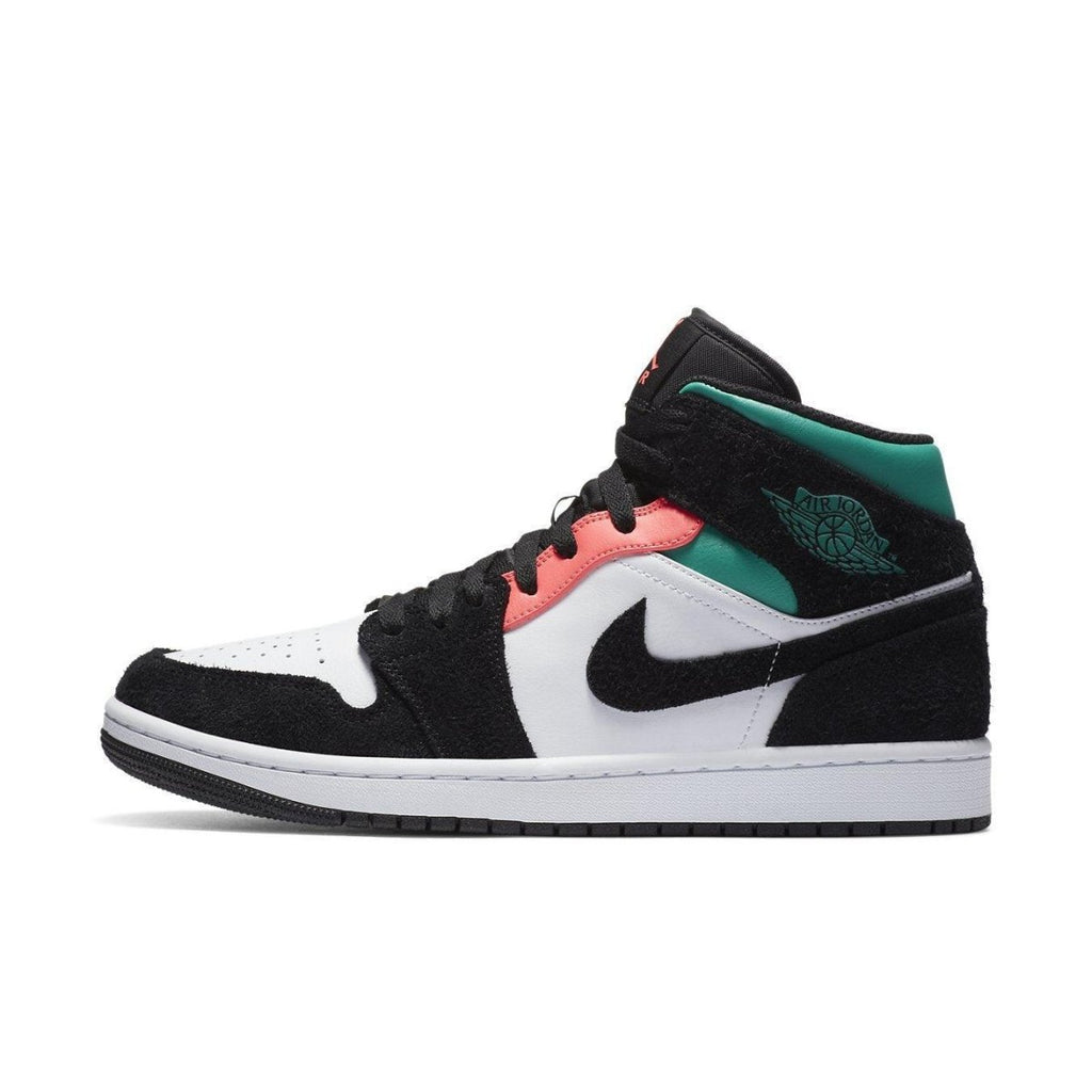 Air Jordan 1 Mid SE South Beach sneaker featuring white leather and black suede, accented with pink and aqua details.