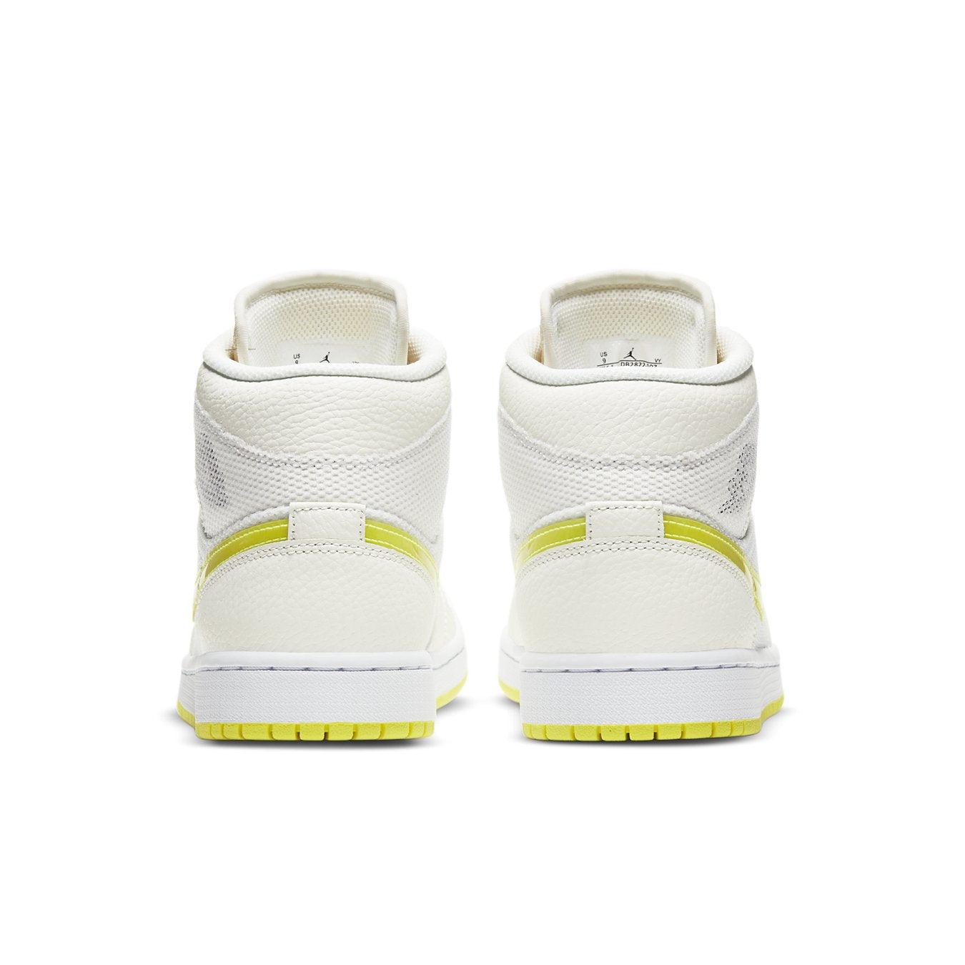 Back view of Air Jordan 1 Mid SE Voltage Yellow women's sneakers with white leather and vibrant yellow accents.