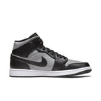 Nike Air Jordan 1 Mid Shadow Red sneakers in black and grey with white outsole and Swoosh design.