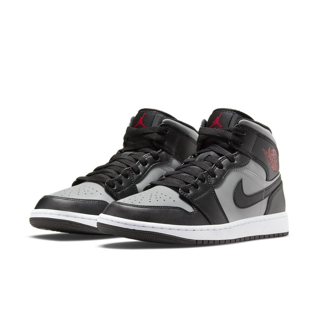 Jordan 1 Mid Shadow Red sneakers featuring grey leather upper with black accents and red Jumpman logo.