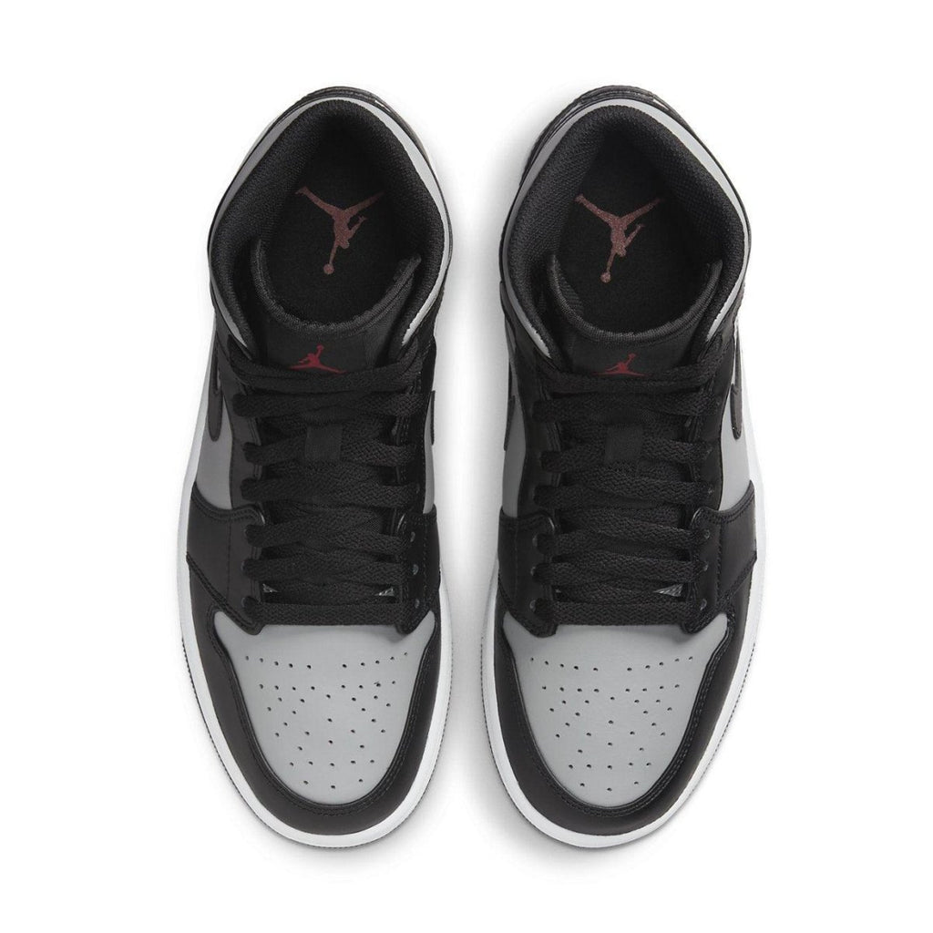 Top view of Air Jordan 1 Mid Shadow Red sneakers featuring gray leather and black accents with red Jumpman logo.