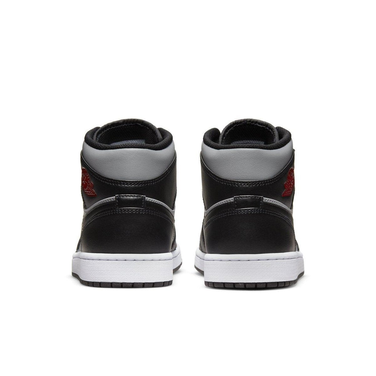Back view of the Jordan 1 Mid Shadow Red sneakers featuring black and grey leather with Gym Red accents.