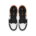 Top view of Nike Air Jordan 1 Mid Shattered Backboard GS sneakers, featuring orange, black, and white color scheme.