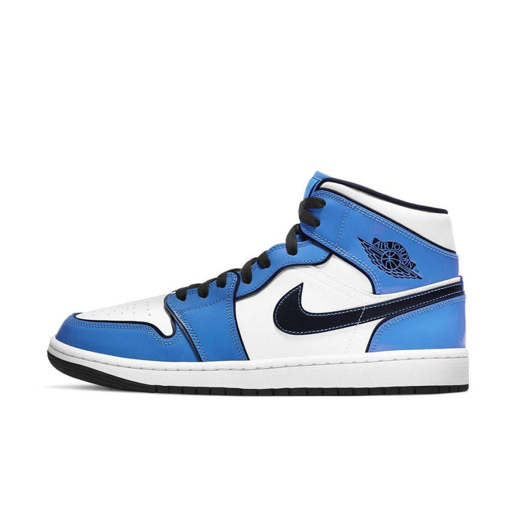 Jordan 1 Mid Signal Blue sneaker in blue and white with black accents, showcasing iconic design and premium materials.