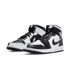 Nike Air Jordan 1 Mid Split Black White for women, featuring black and white leather panels in a stylish design.