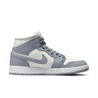 Jordan 1 Mid Stealth for women featuring a clean sail and grey colorway with classic white midsole.