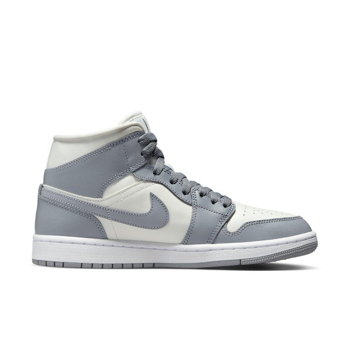 Jordan 1 Mid Stealth for women featuring a clean sail and grey colorway with classic white midsole.