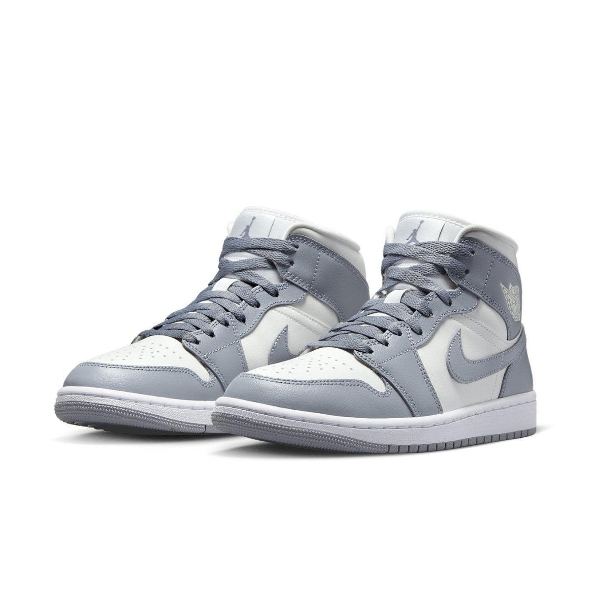 Jordan 1 Mid Stealth (W) sneakers featuring a clean sail and gray colorway, mid-top silhouette, and iconic Swoosh.