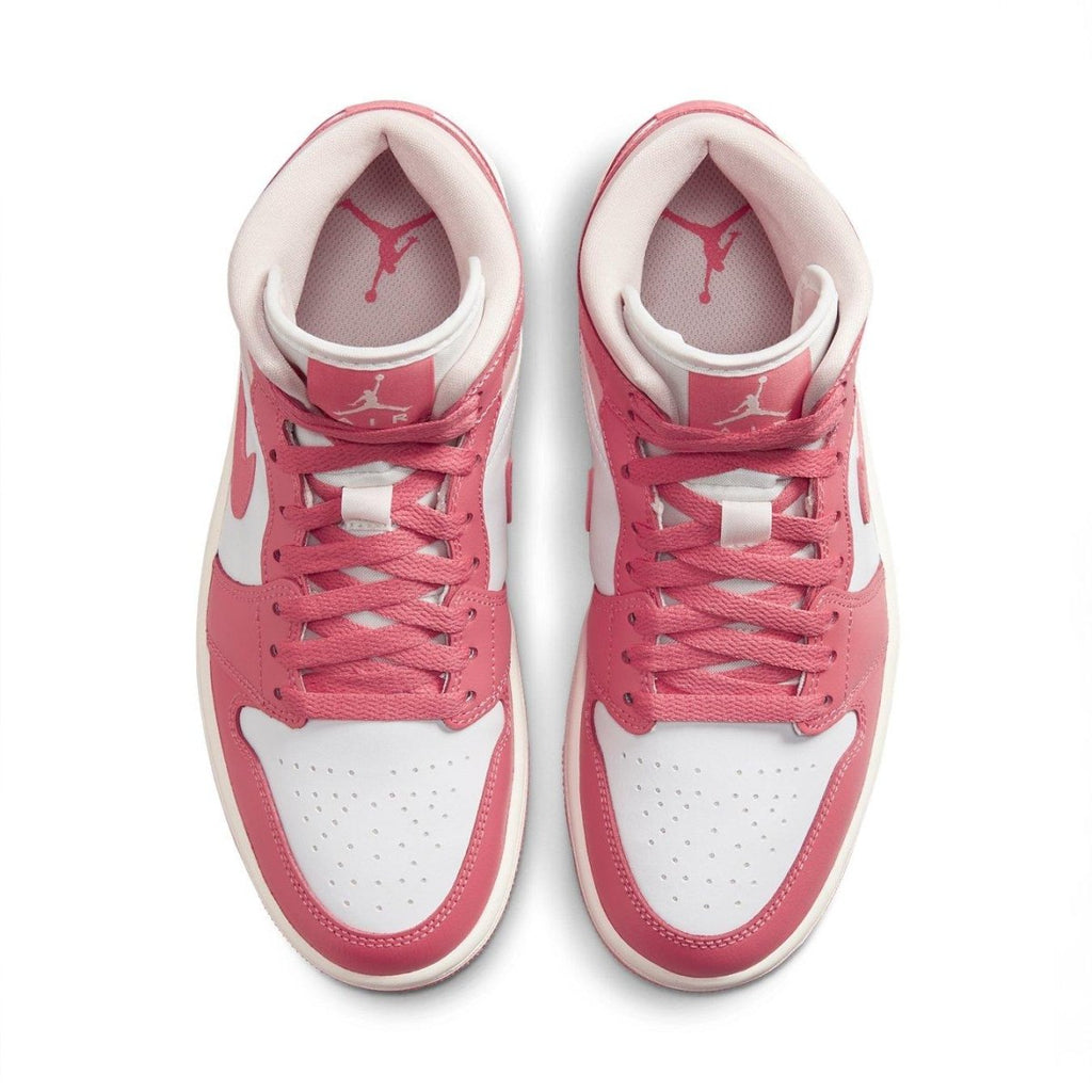 Jordan 1 Mid Strawberries and Cream for women, featuring pink and white leather upper with iconic branding.