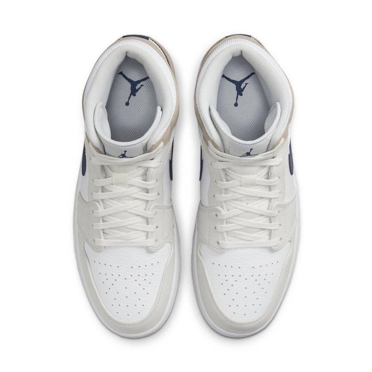 Air Jordan 1 Mid Tan Suede top view, featuring white leather, dark blue Swoosh, and suede overlays.