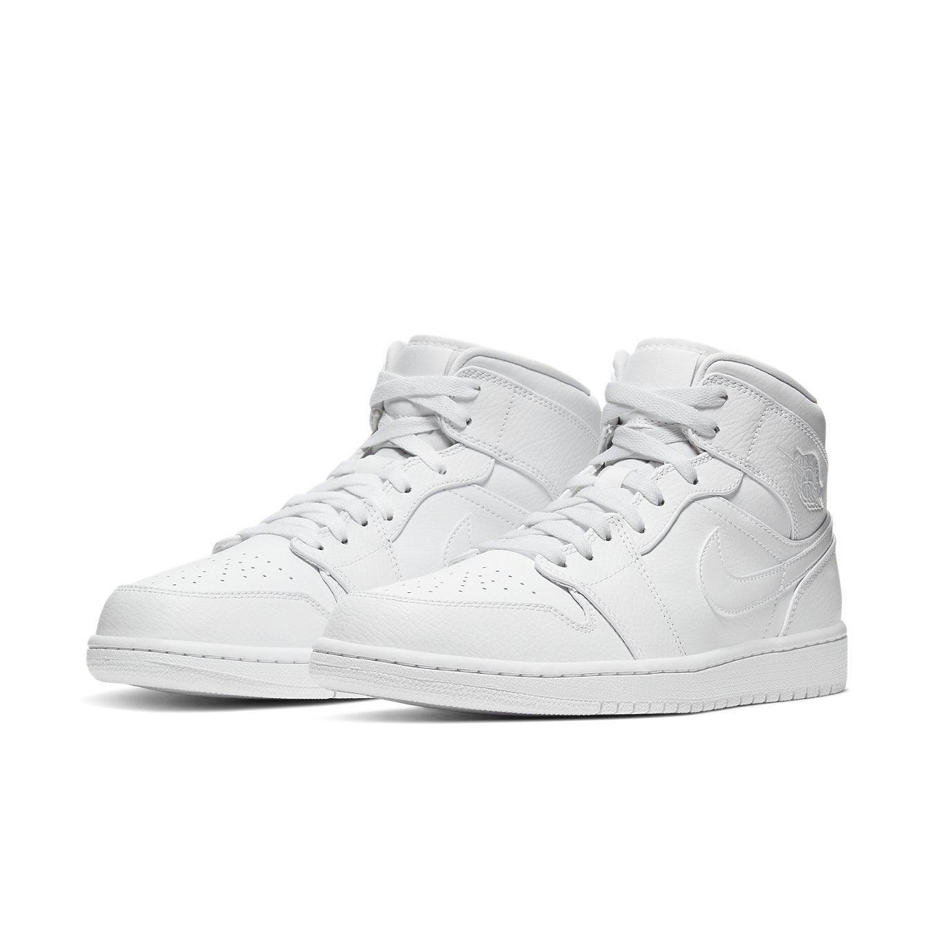 Jordan 1 Mid Triple White (2020) sneakers featuring a clean all-white design and mid-top silhouette.