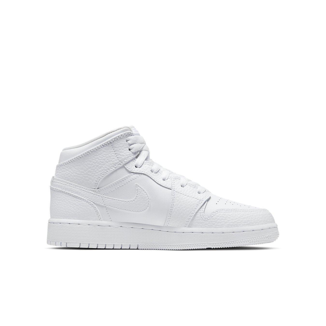 Air Jordan 1 Mid GS Triple White sneakers for kids in pristine white leather with Swoosh and signature details.