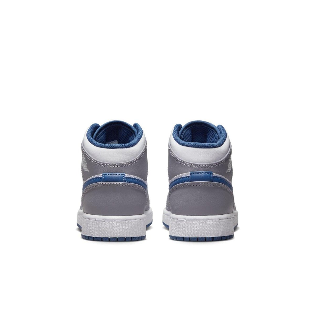 Rear view of Air Jordan 1 Mid True Blue Cement GS showcasing grey and blue colorway with white midsole.