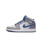 Jordan 1 Mid True Blue Cement (GS) in white and gray leather with blue accents, featuring perforated toe and oversized Swoosh.