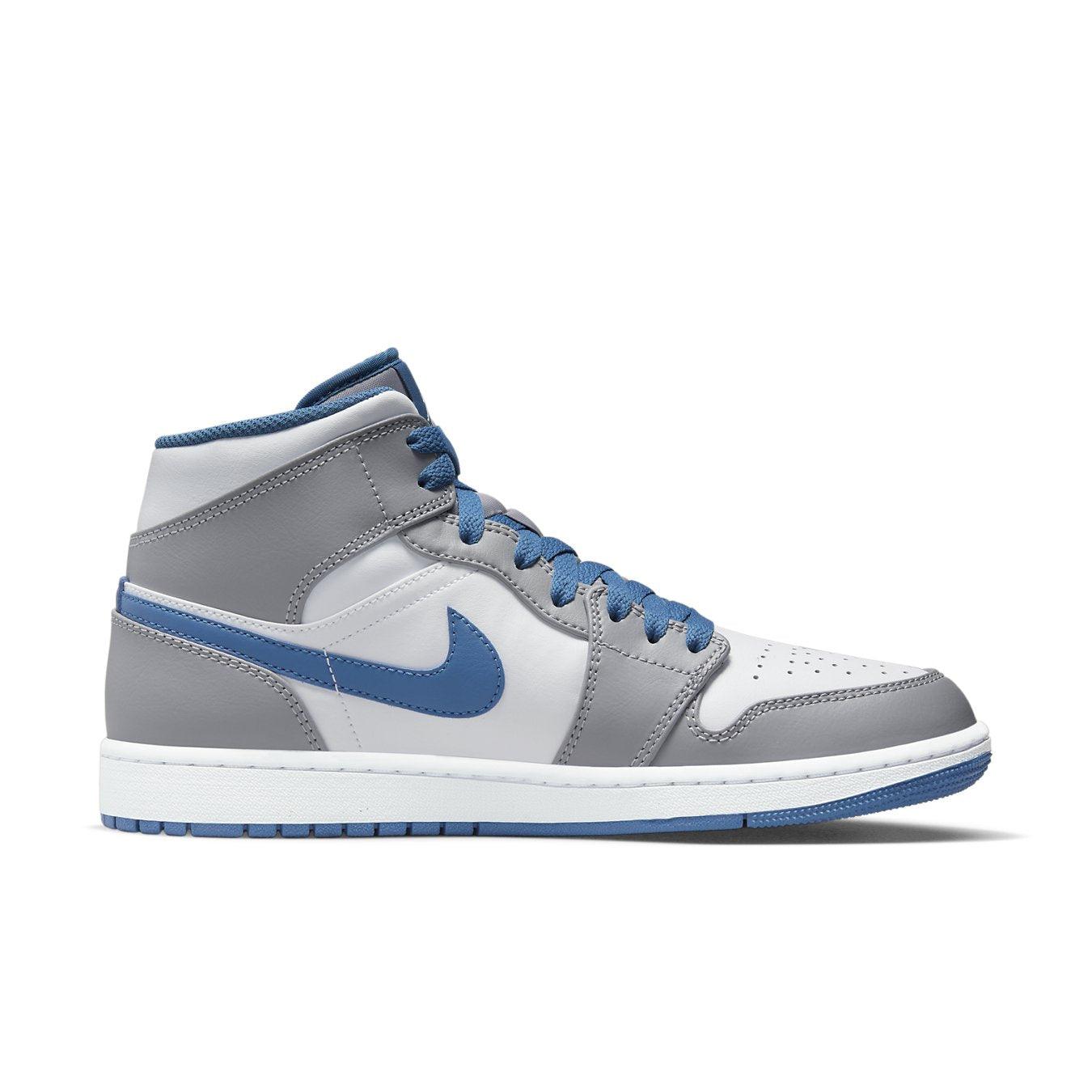 Nike Air Jordan 1 Mid True Blue featuring a white leather upper with True Blue accents and perforations for breathability.