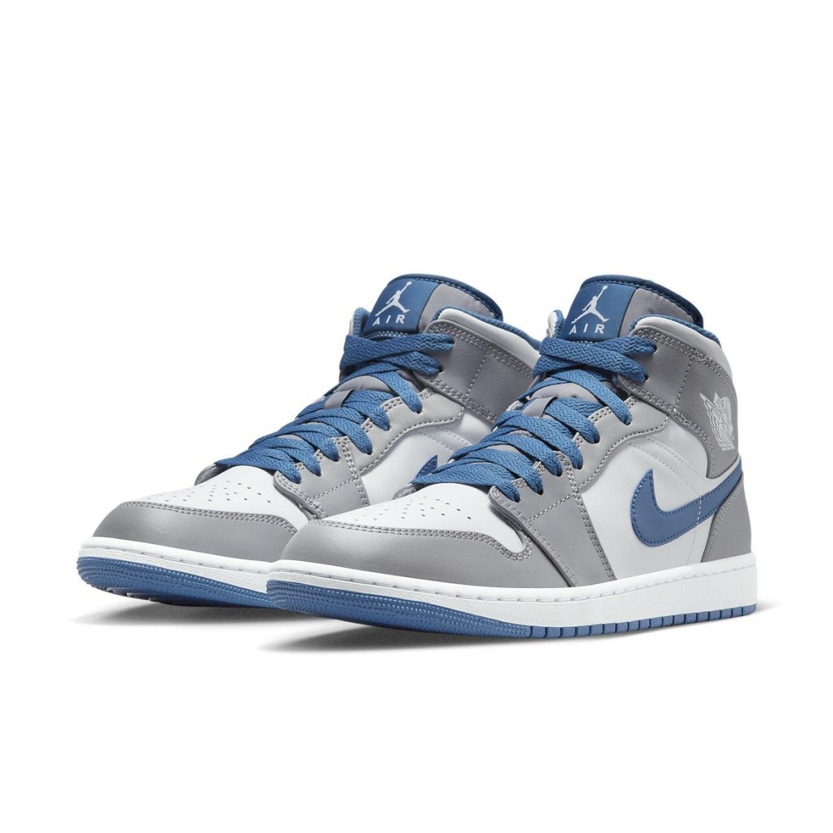 Air Jordan 1 Mid True Blue in white leather with True Blue accents and oversized Swoosh, offering stylish comfort.