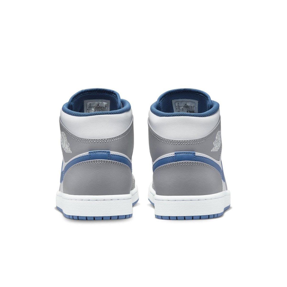 Rear view of Air Jordan 1 Mid True Blue sneakers showcasing grey leather and True Blue accents.